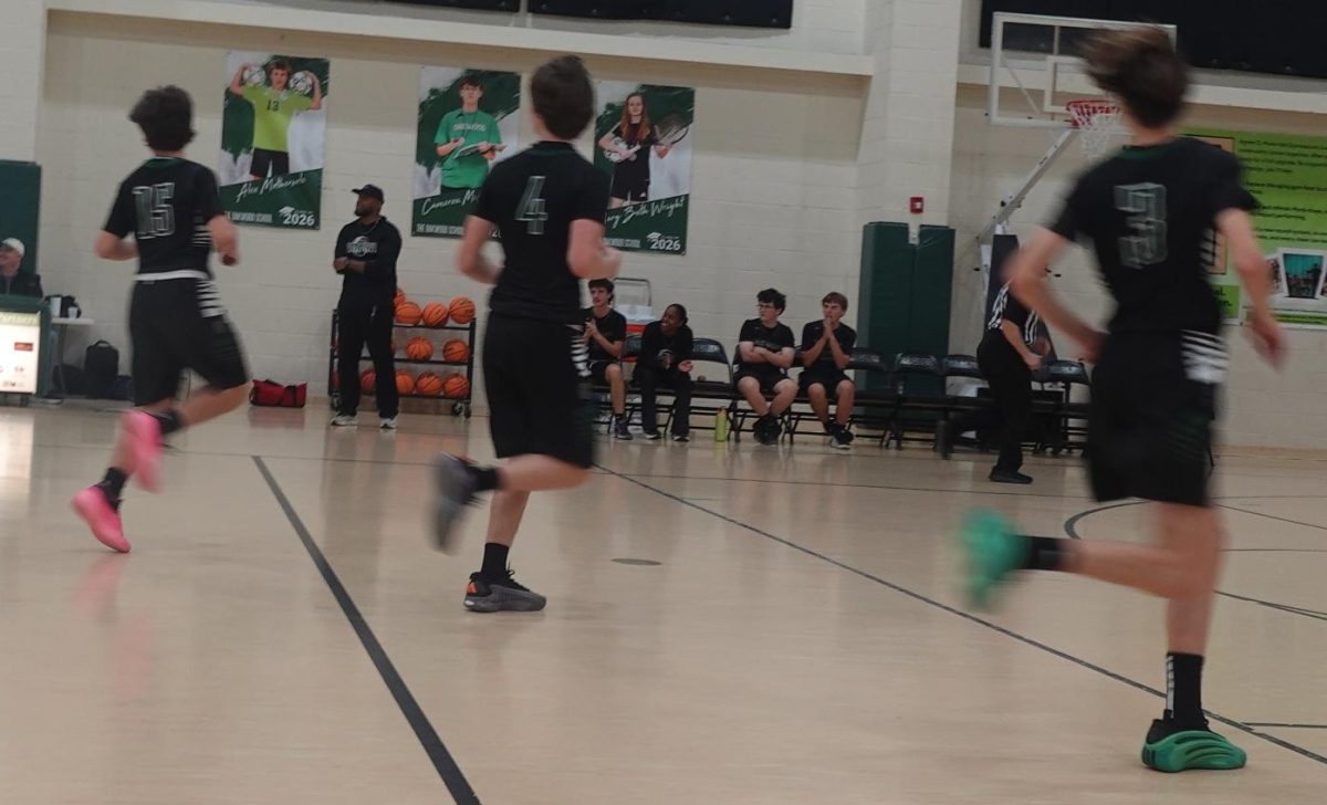 Varsity Boys Basketball Players Running